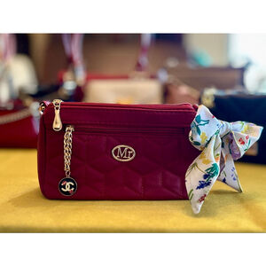 Red accessorized Mr Puffer crossbody bag